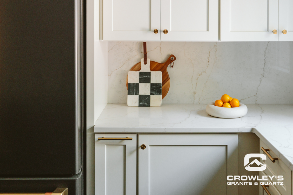 White kitchen counter top with checker cutting board by Crowleys Granite