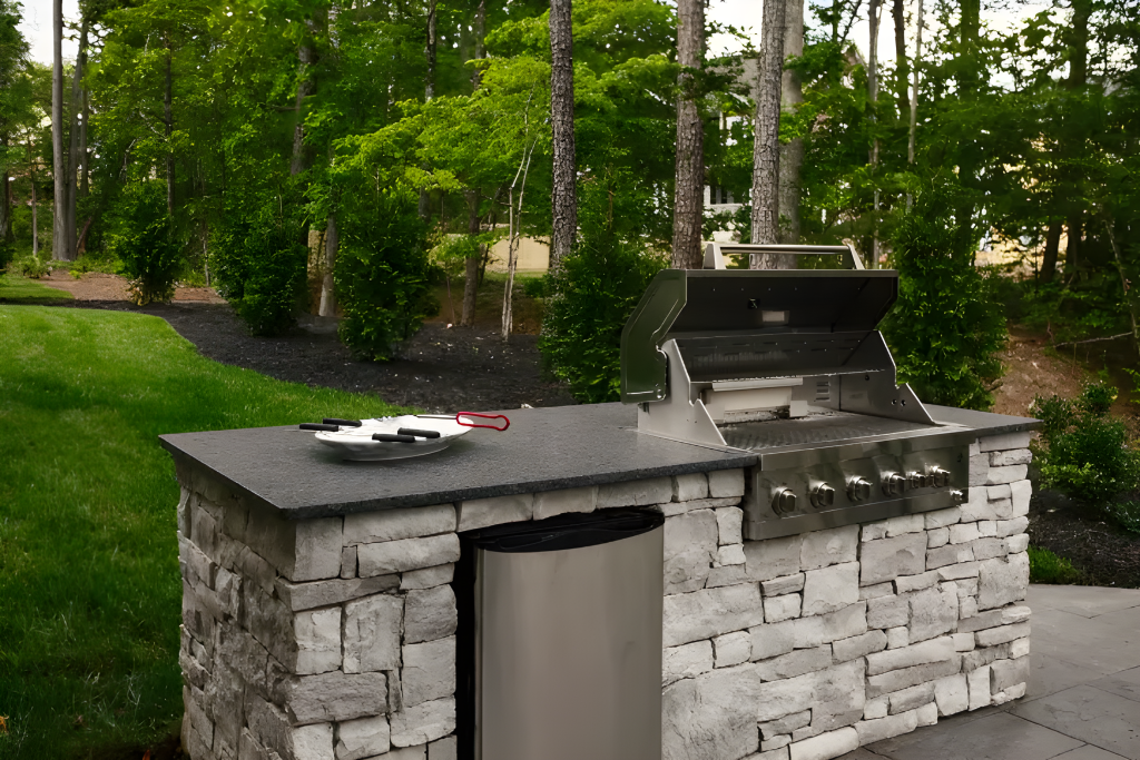 Backyard outdoor kitchen with table and integrated bbq and washer.