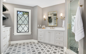 Bathroom vanity with countertop and decorative tile flooring