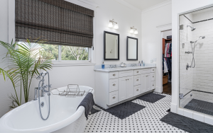 Bathroom with freestanding tub and quartz vanity countertop