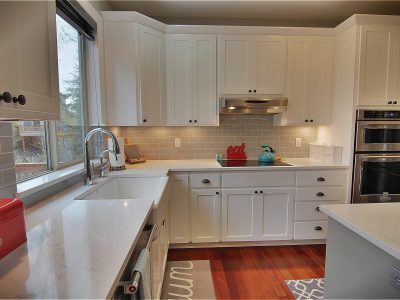 modern kitchen with white quartz countertops